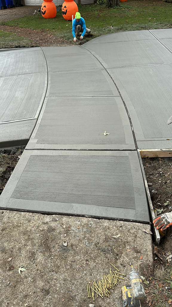 Decorative concrete driveway with band