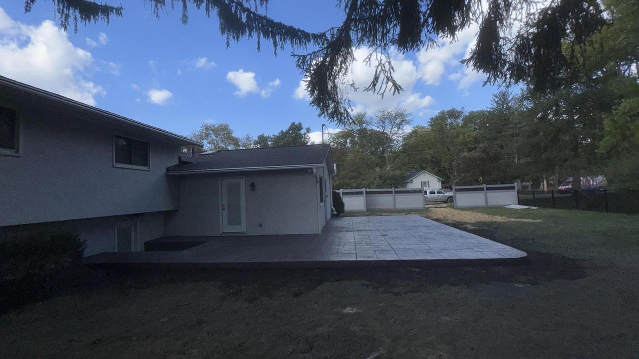 Grey stamped concrete patio at a Columbus ranch home