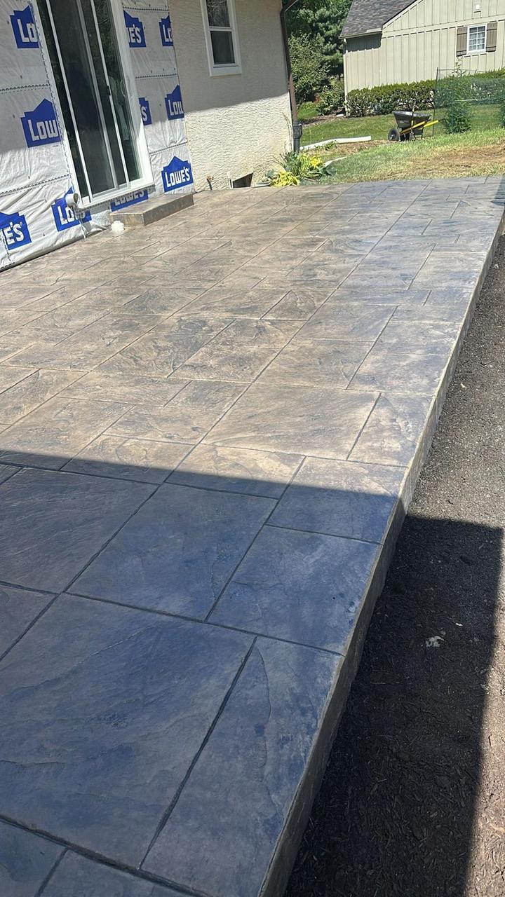 Stamped concrete patio edge detail showing hand-tooled border