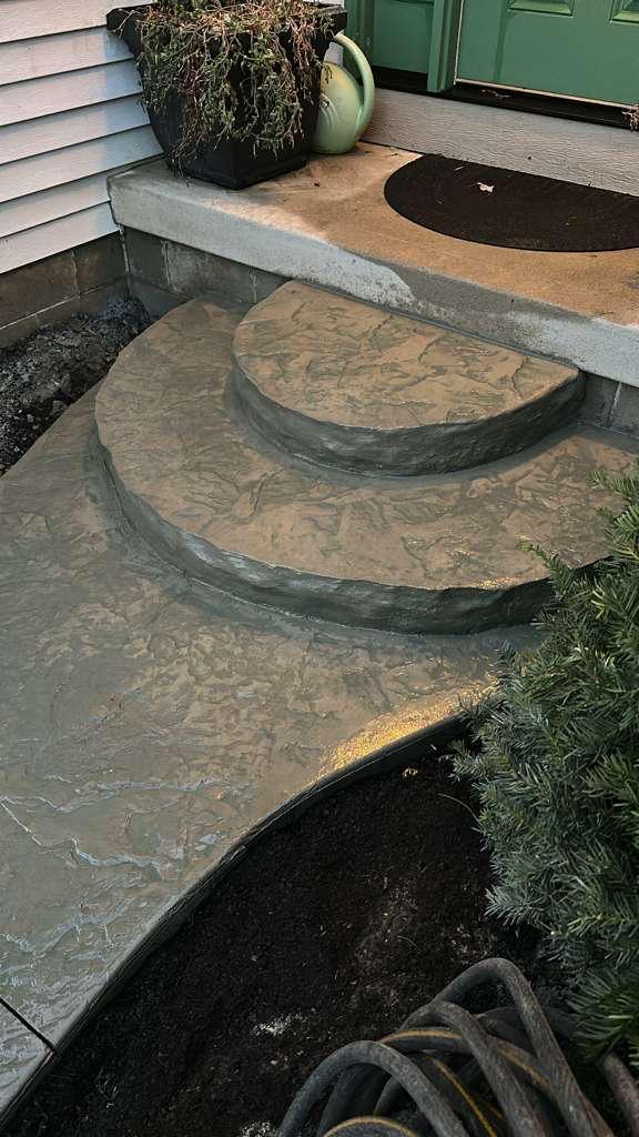 Rounded stamped concrete steps at a home entry