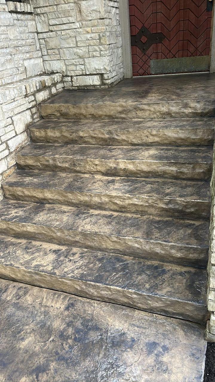 Stamped concrete front steps with hand-carved stone texture